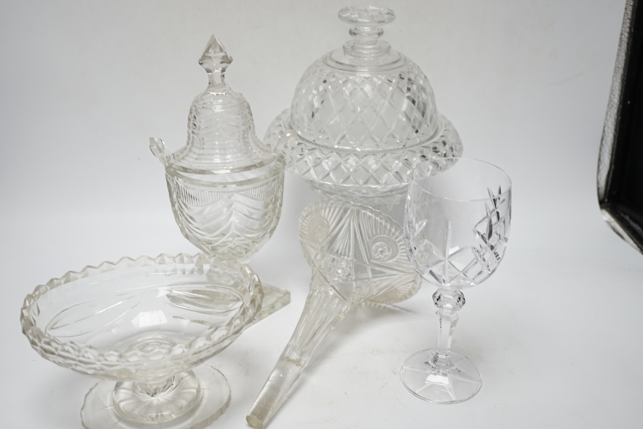 Ten cut glass items including; four pedestal bowls and covers, two oval, pedestal dishes, a two oval, pedestal dishes, a jug, a pair of glasses, etc., tallest, 26cm